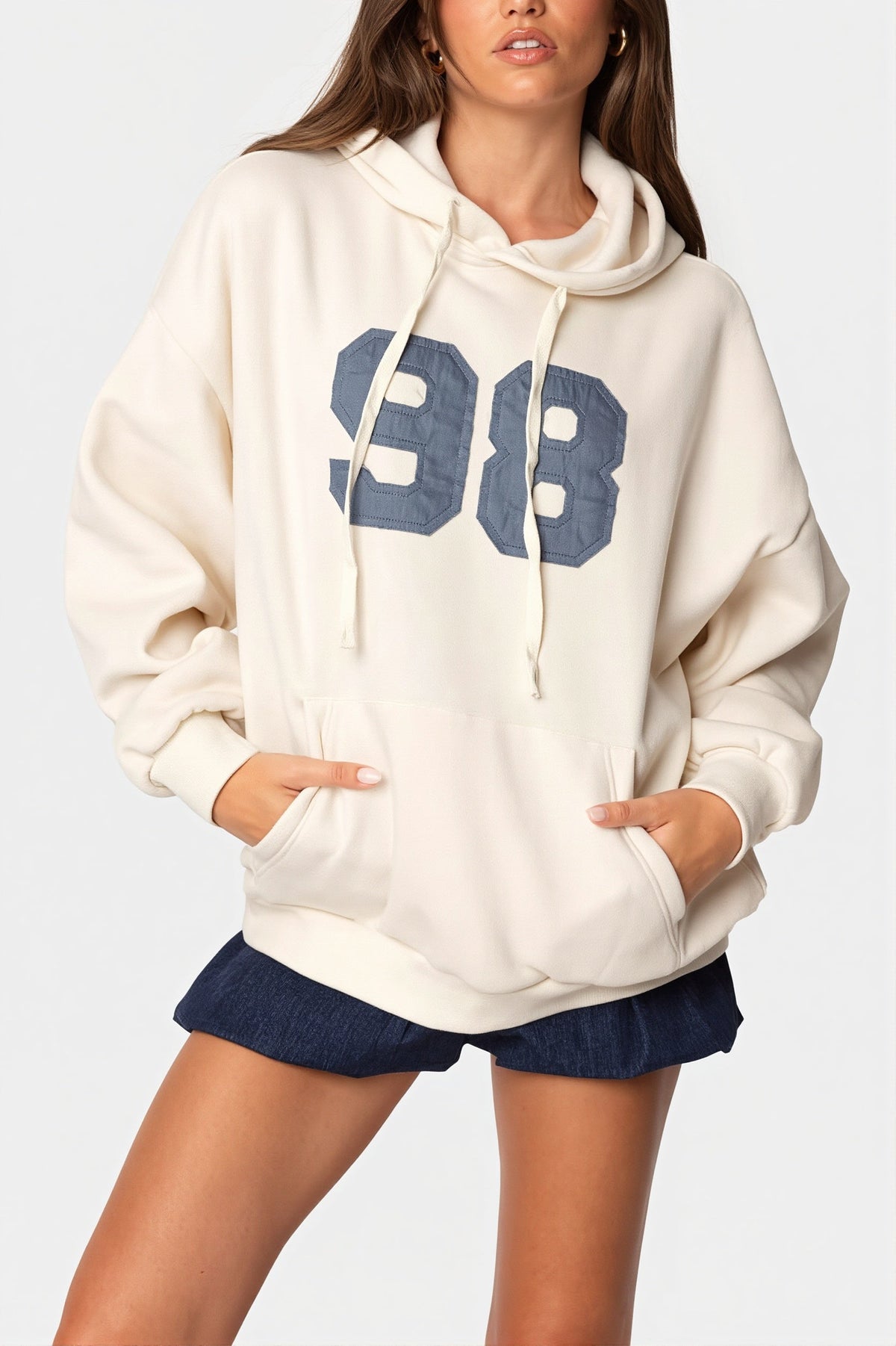 Women's oversized hooded pullover with long sleeves, pouch pocket and number graphic