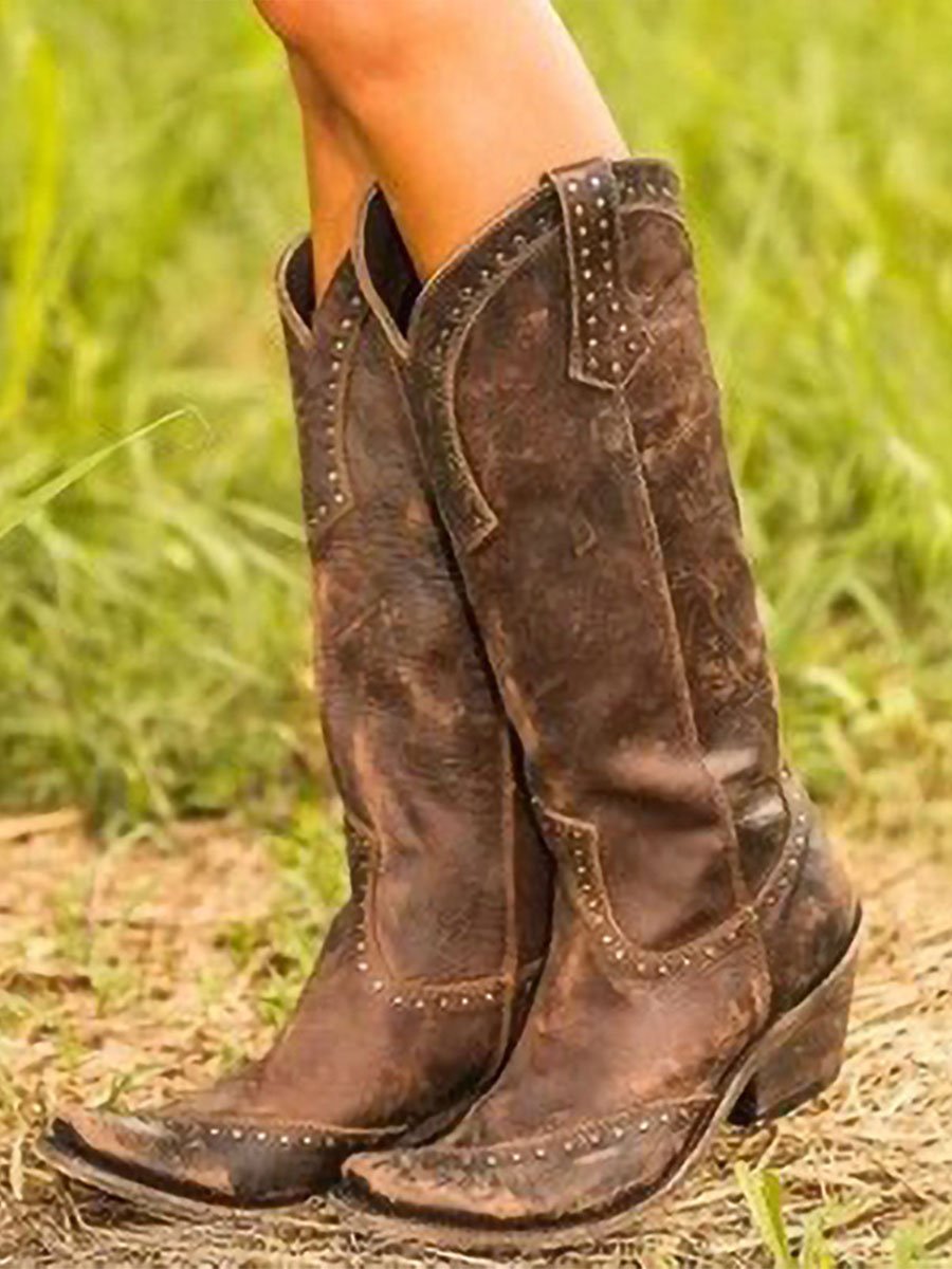 Women's studded cowboy boots with pointed toes, pull tabs and low heels