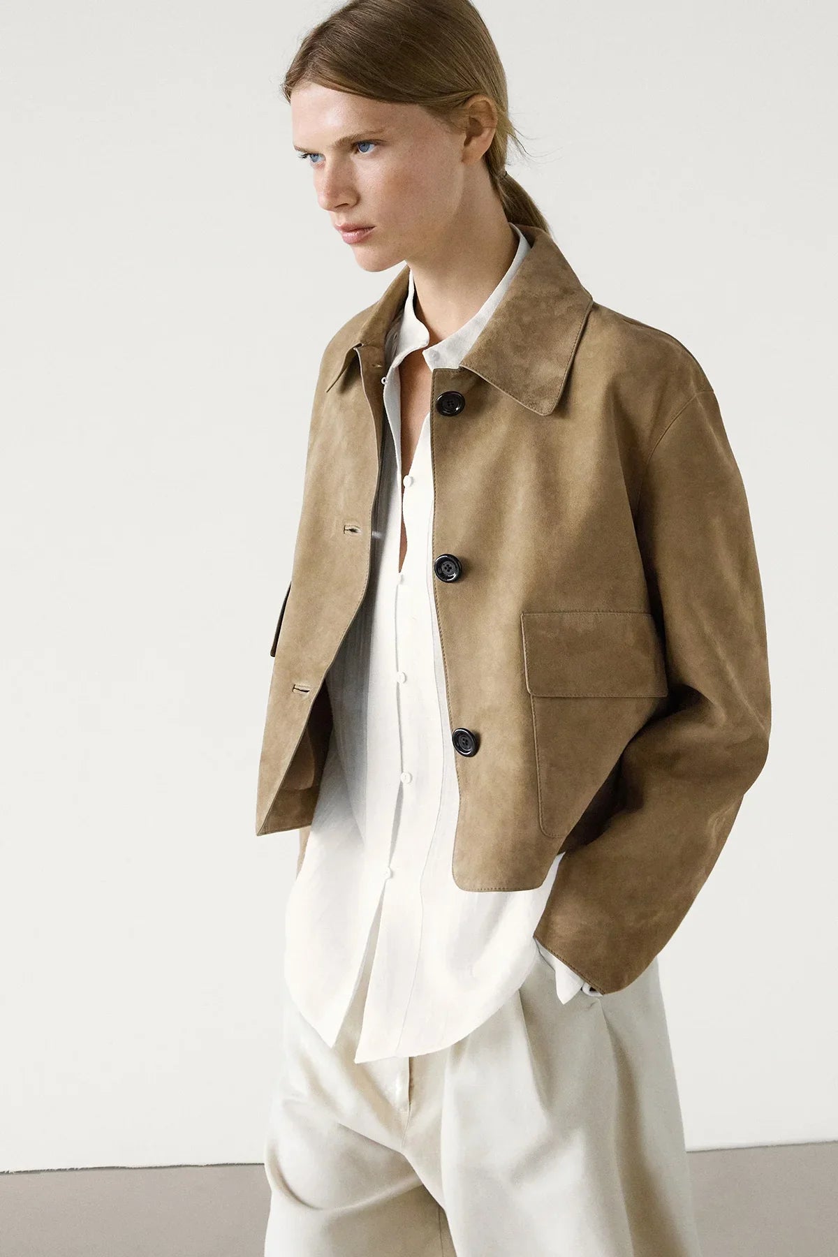 Women's sand cropped jacket with pointed collar, button front and flap pockets