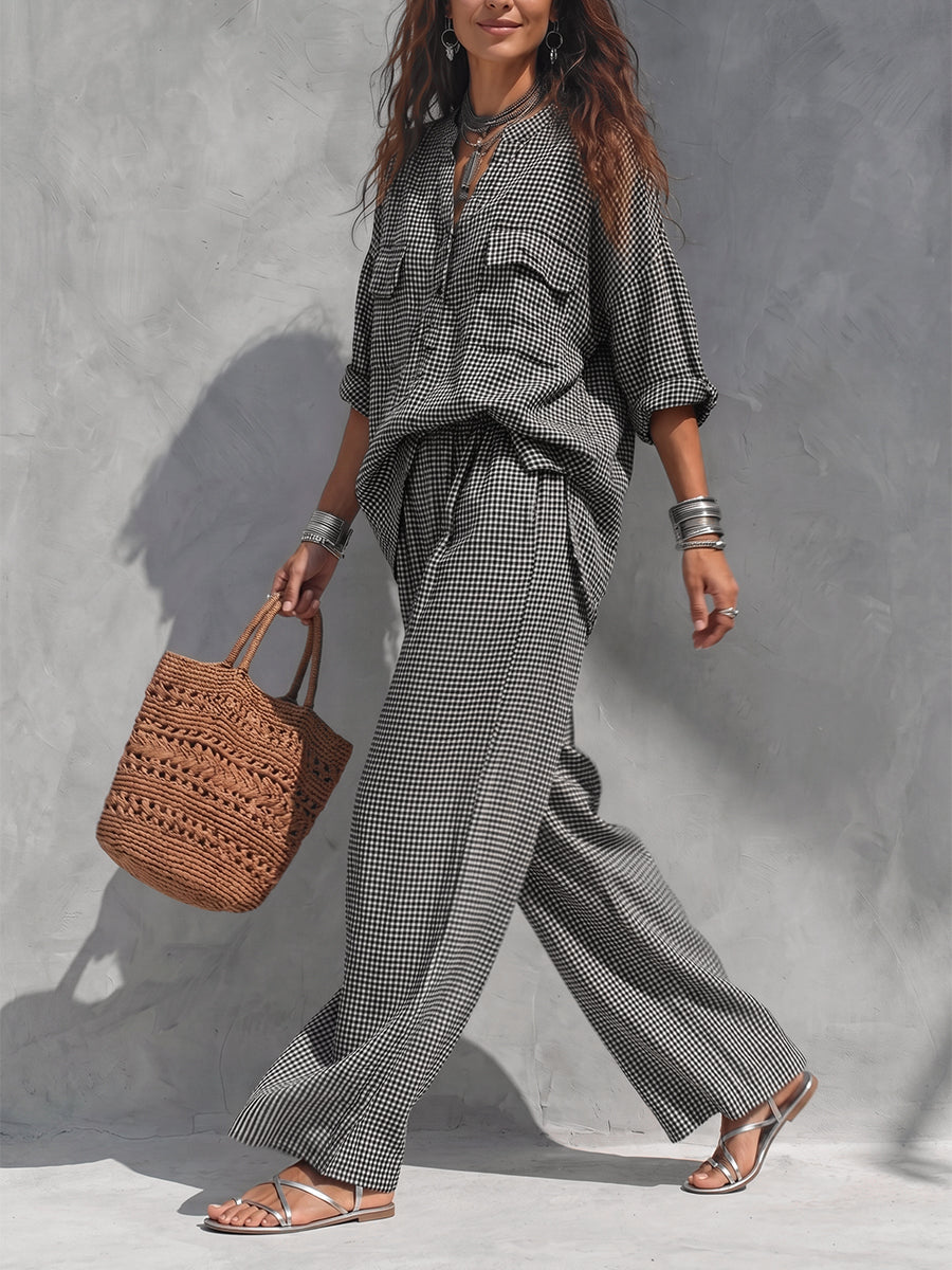 Women's black and white checked wide-leg trousers with elasticated waist and side pockets