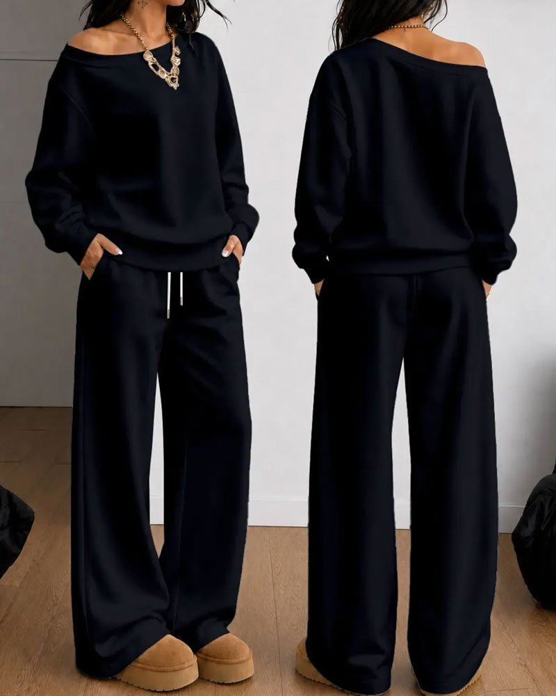 Women's asymmetric sweatshirt and wide-leg trousers set shown in white and black