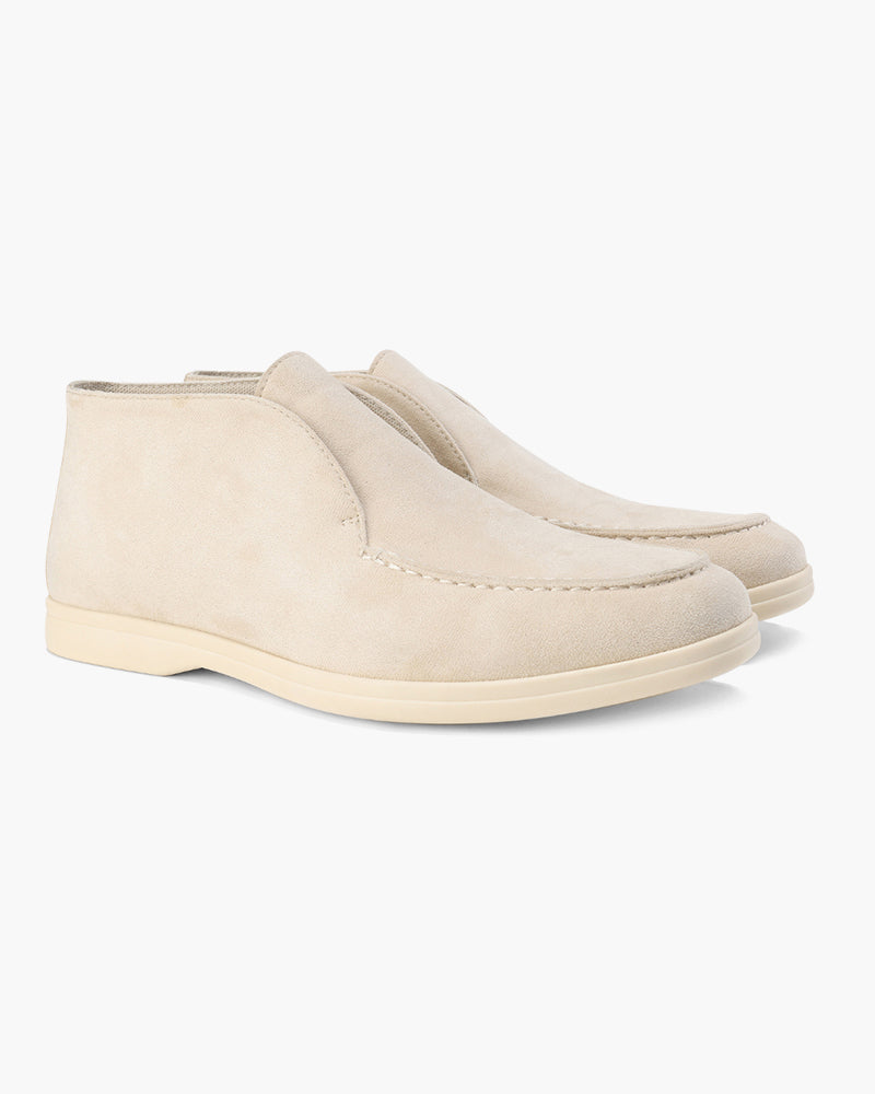 Ankle-height slip-on loafers with round toes and flat soles