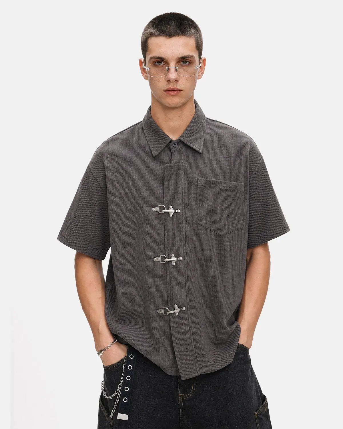 Men's grey waffle-textured short-sleeve shirt with metal clasps and chest pocket