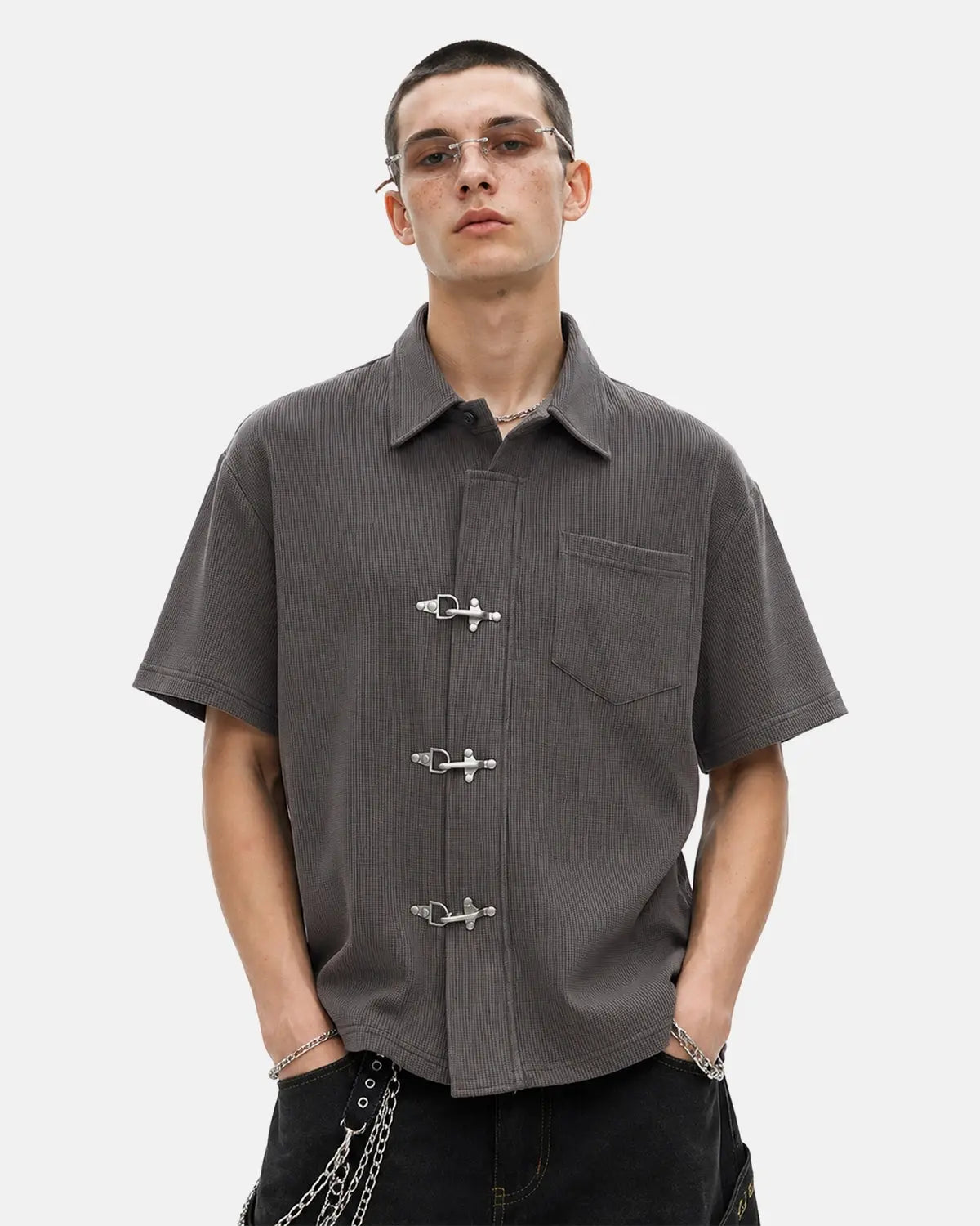 Men's grey waffle-textured short-sleeve shirt with metal clasps and chest pocket
