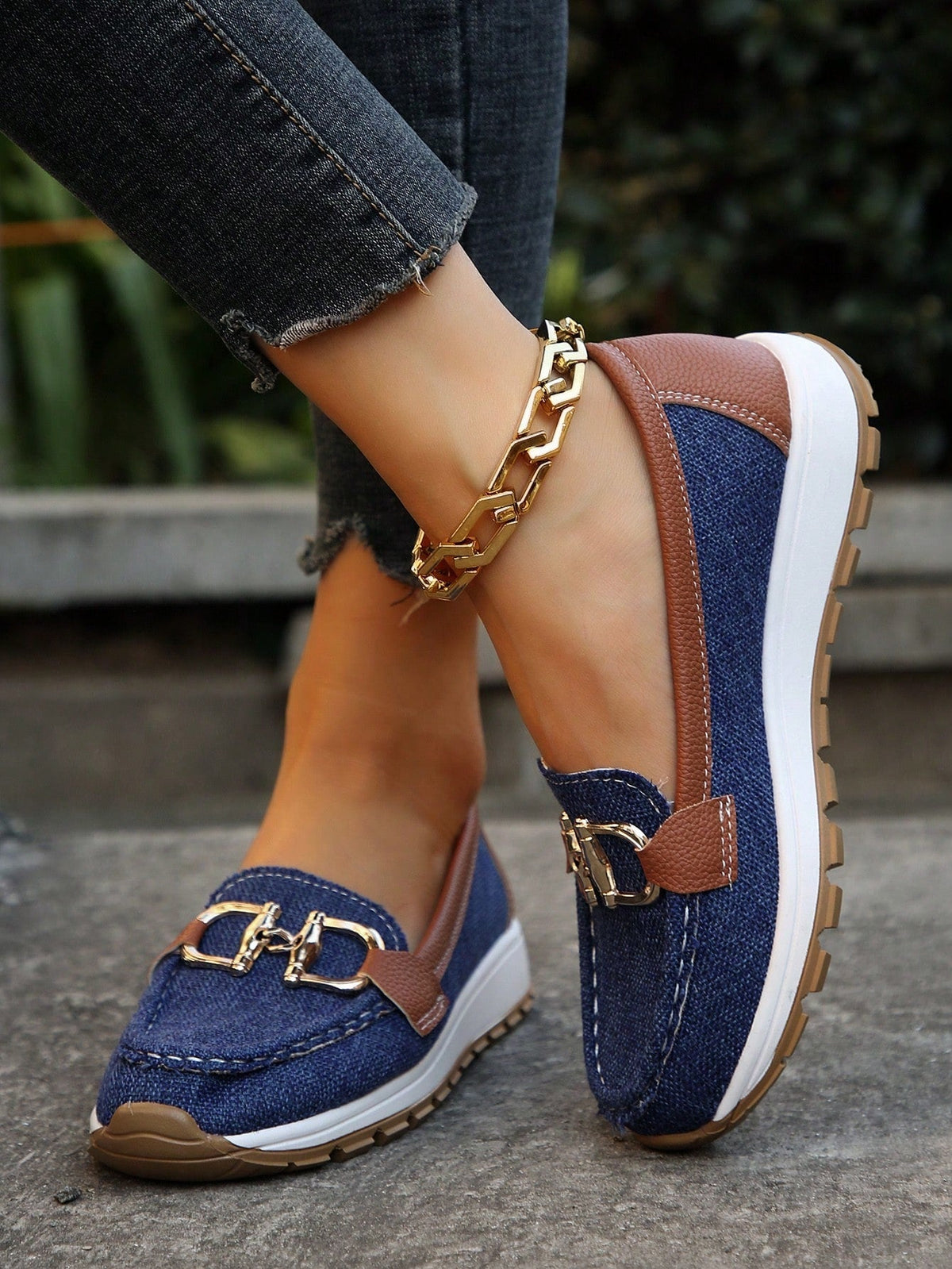 Women's flat loafers with moc stitching and gold-tone buckle trim