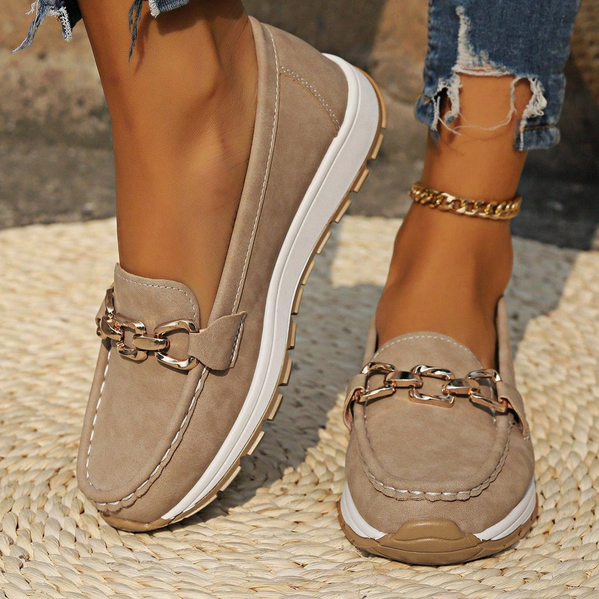 Women's flat loafers with metallic buckle trim and textured lug soles