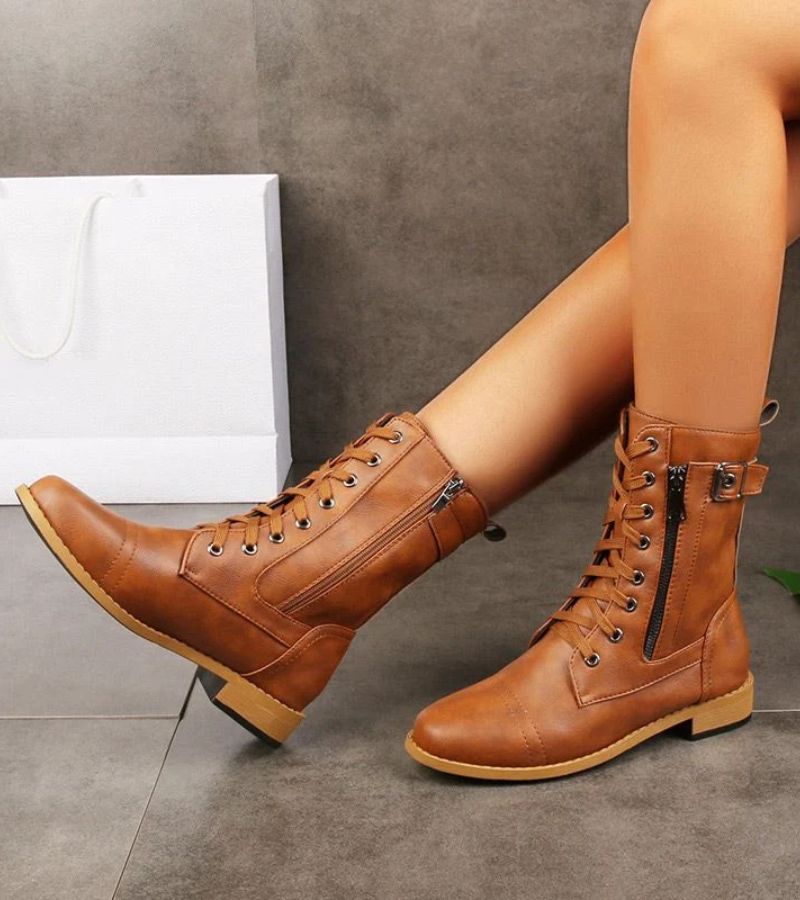 Women's mid-height combat boots with laces, side zip and buckle detail