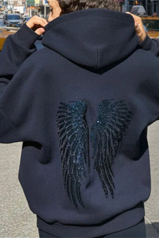 Women's hooded sweatshirt with large sequin wing graphic on the back