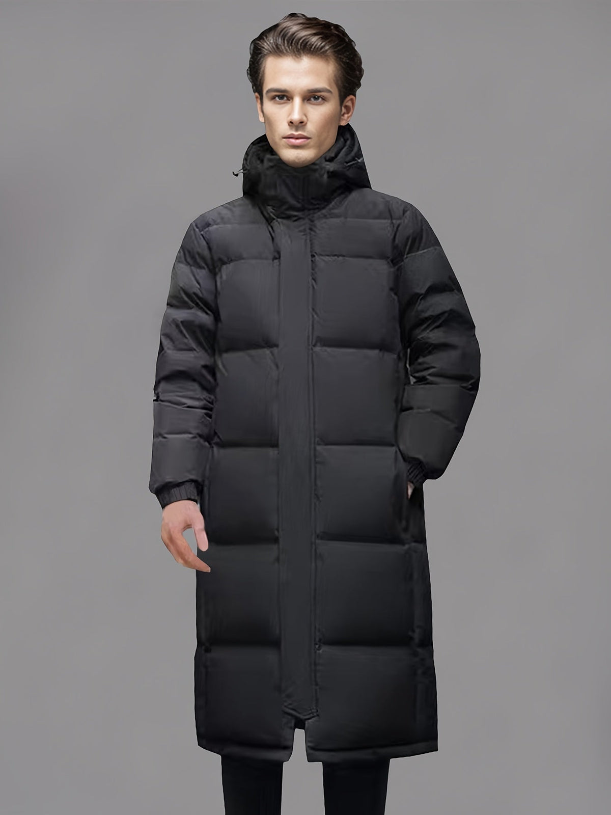 Men's black long hooded puffer coat with quilted panels and front zip