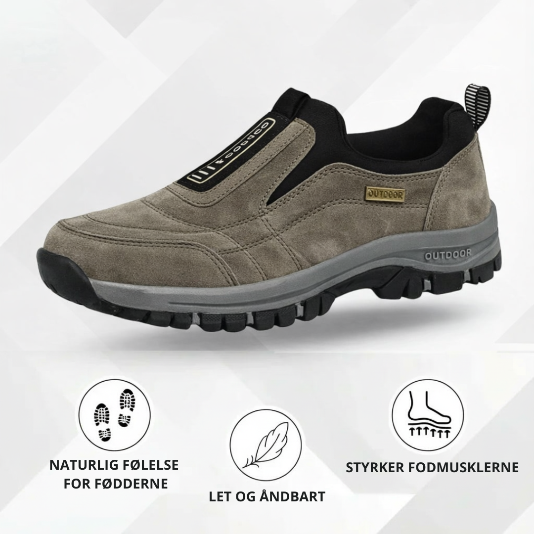Slip-on walking shoe with stitched panels, contrast sole and deep tread