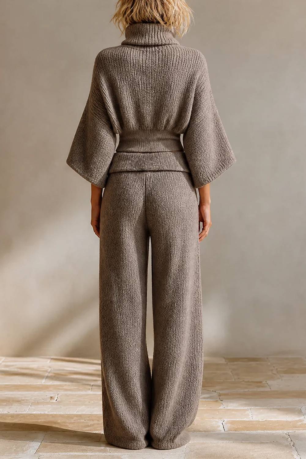 Women's grey turtleneck knit cropped top and wide-leg trouser set with belt