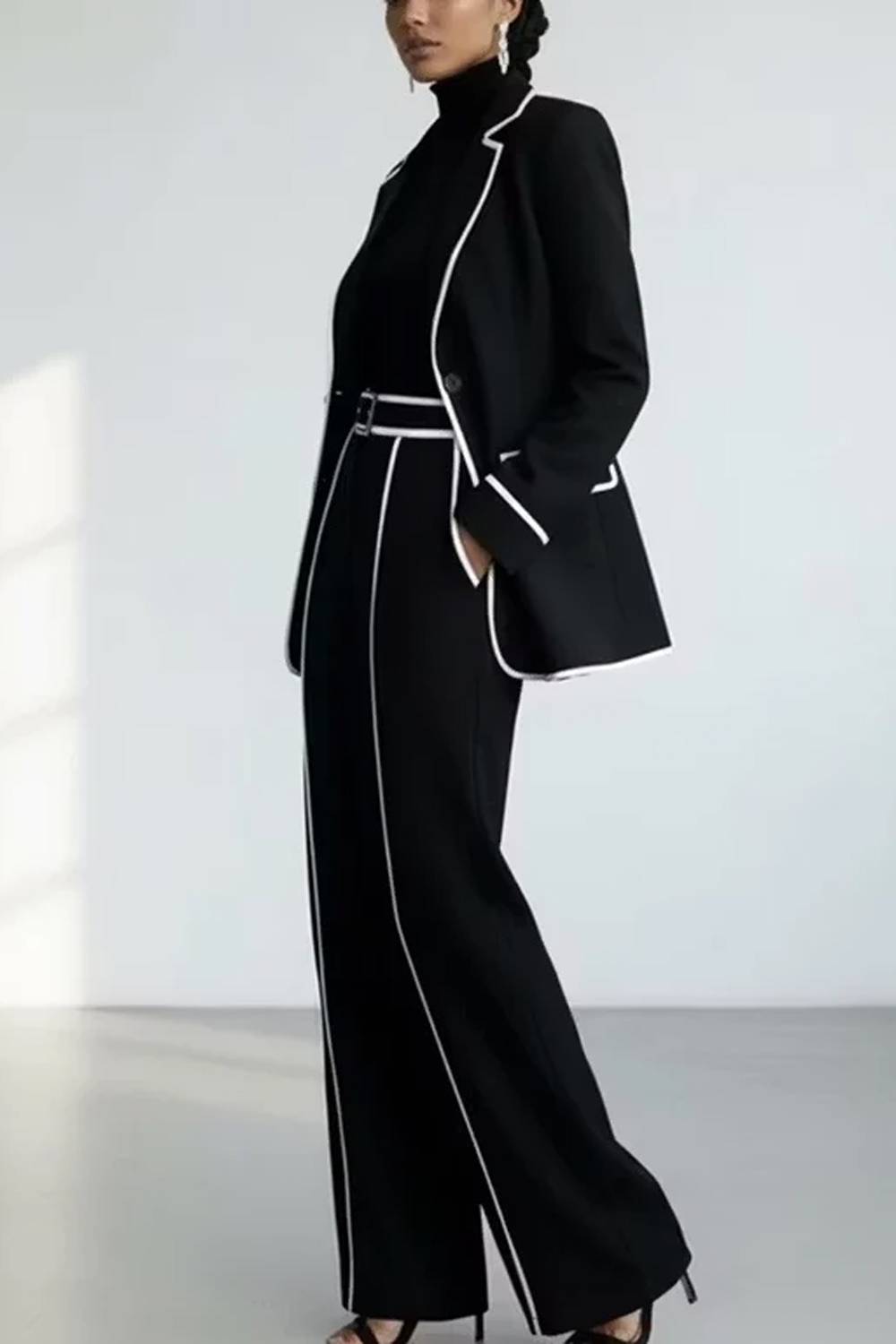 Women's two-piece trouser set with piped blazer and wide-leg trousers