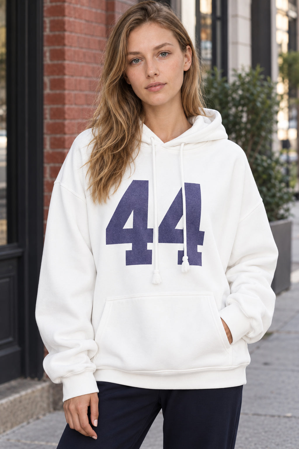 Women's oversized hoodie with hood, front kangaroo pocket and bold number graphic
