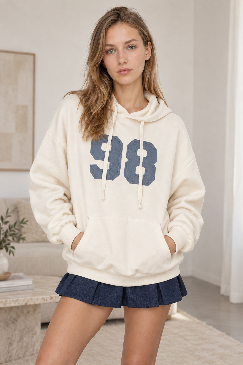 Women's oversized hoodie with hood, front kangaroo pocket and bold number graphic