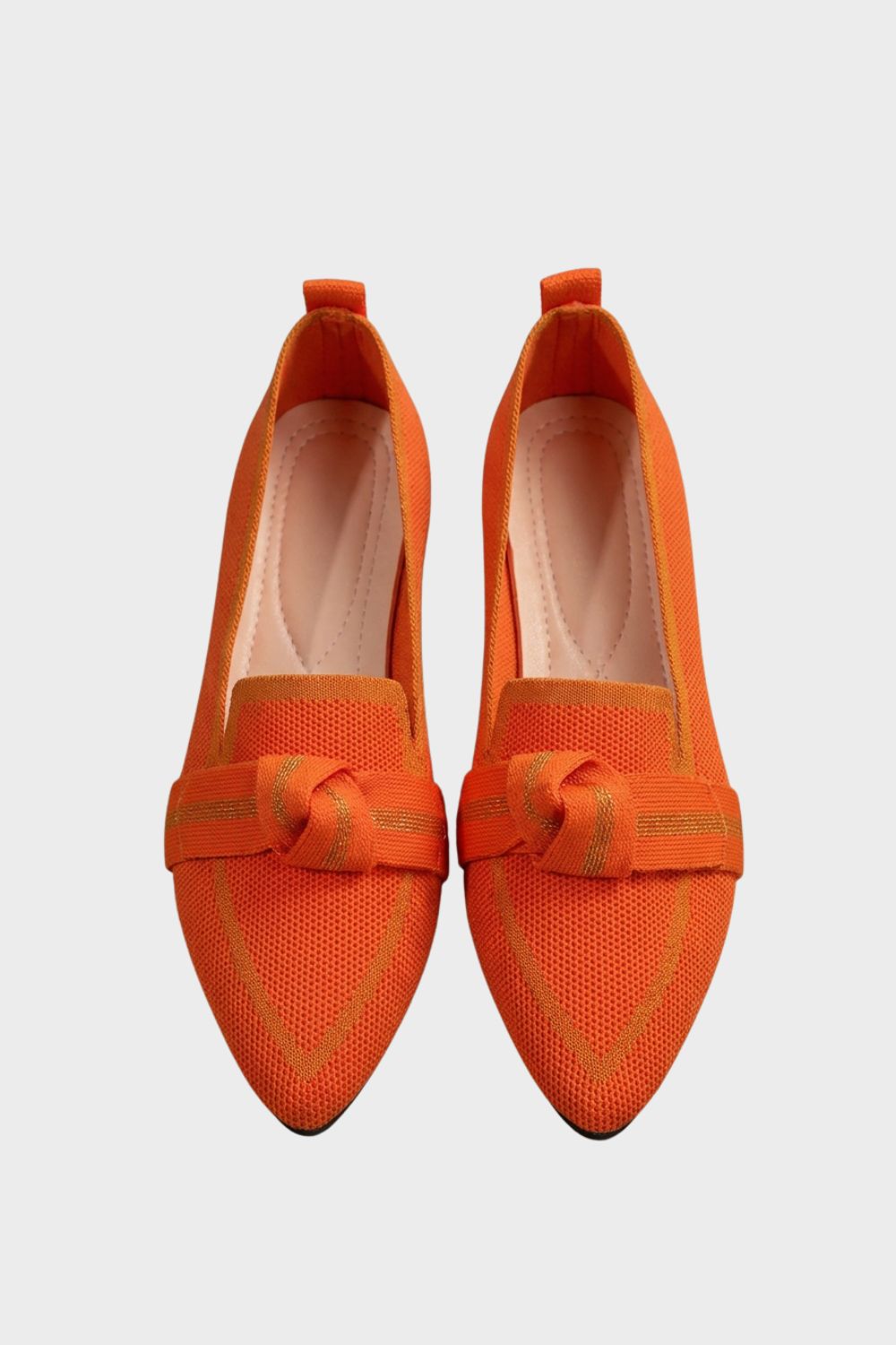 Women's pointed-toe loafers with bow trim and contrast edging