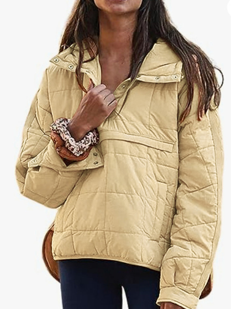 Women's oversized quilted hooded pullover jacket with long sleeves and front pockets