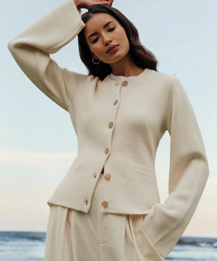 Women's button front cardigan with crew neckline, long sleeves and front pockets