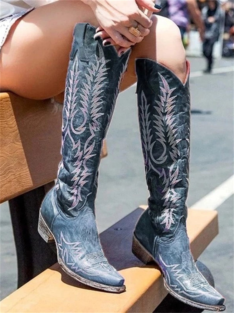 Knee-high western cowboy boots with embroidered botanical detailing and pointed toes