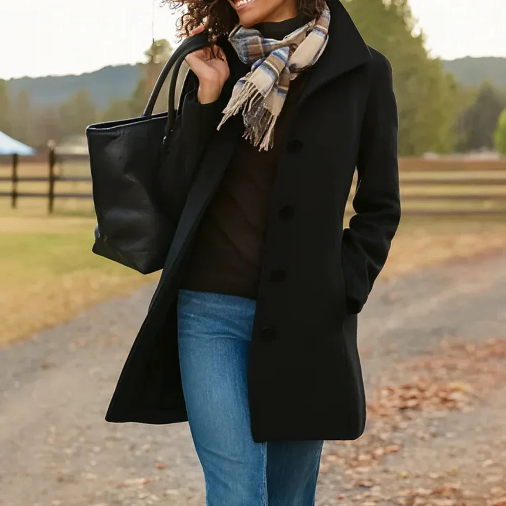 Women's long button-front coat with shirt collar, long sleeves and side pockets