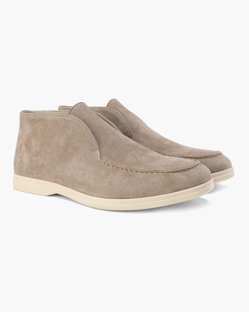 Ankle-height slip-on loafers with round toes and flat soles