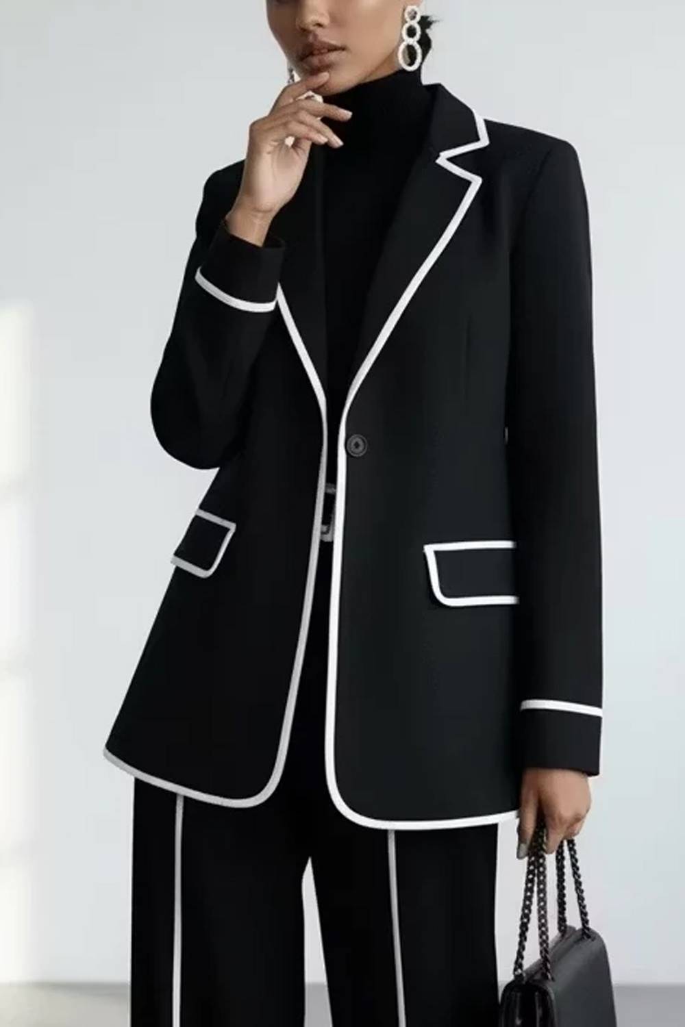 Women's two-piece trouser set with piped blazer and wide-leg trousers