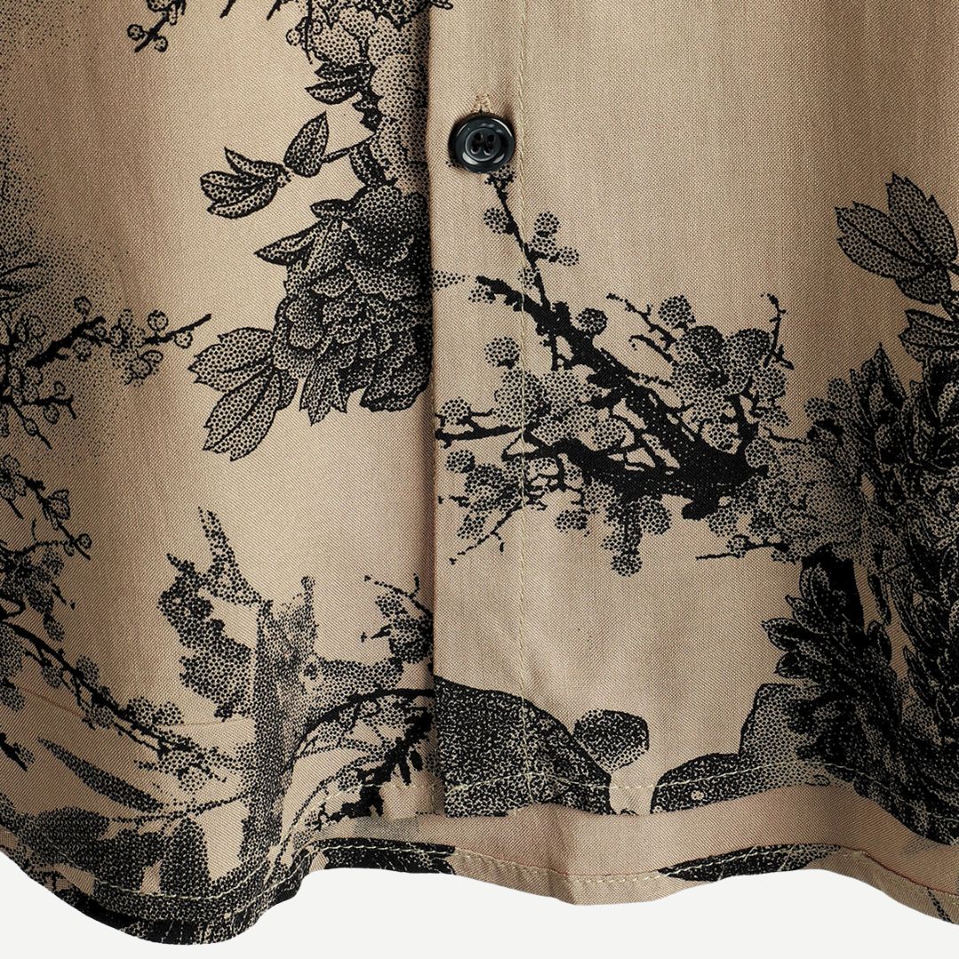Men's beige short sleeve shirt with black floral print and button front