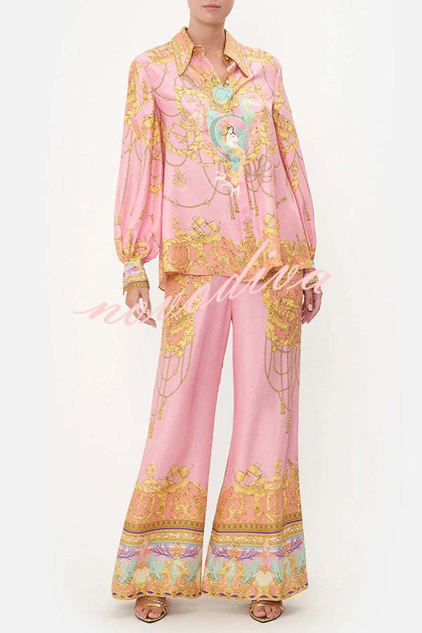 Woman wearing a pink abstract print shirt and wide-leg trousers set