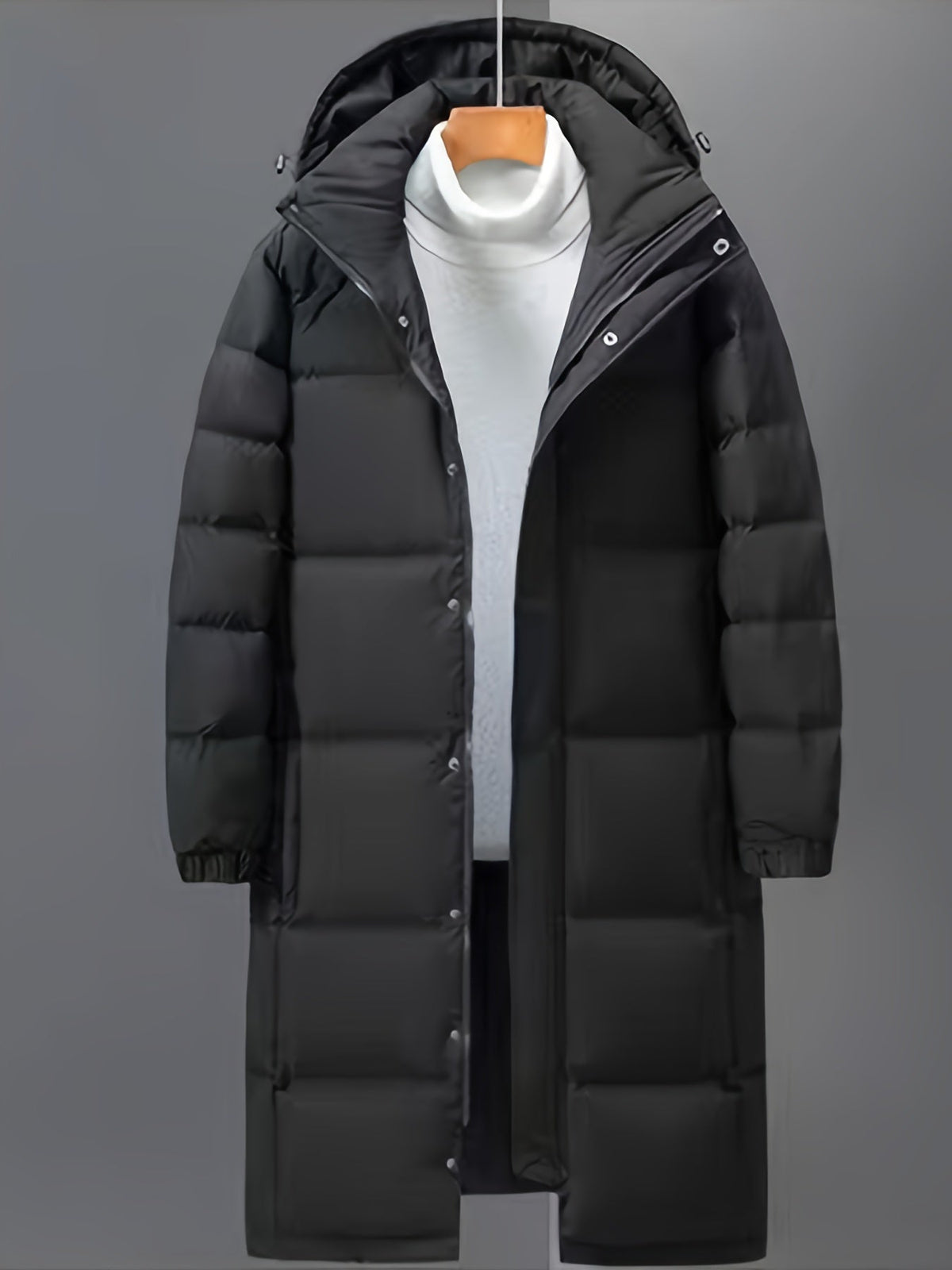 Men's black long hooded puffer coat with quilted panels and front zip