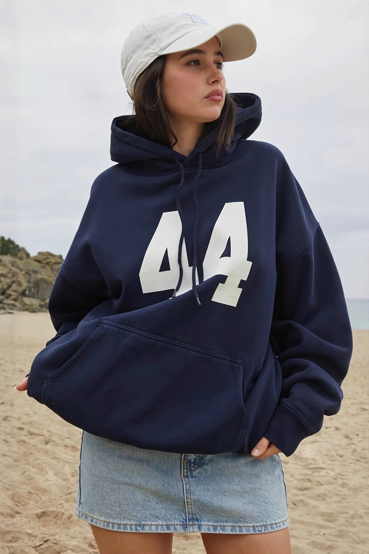 Women's oversized hooded pullover with long sleeves, pouch pocket and number graphic