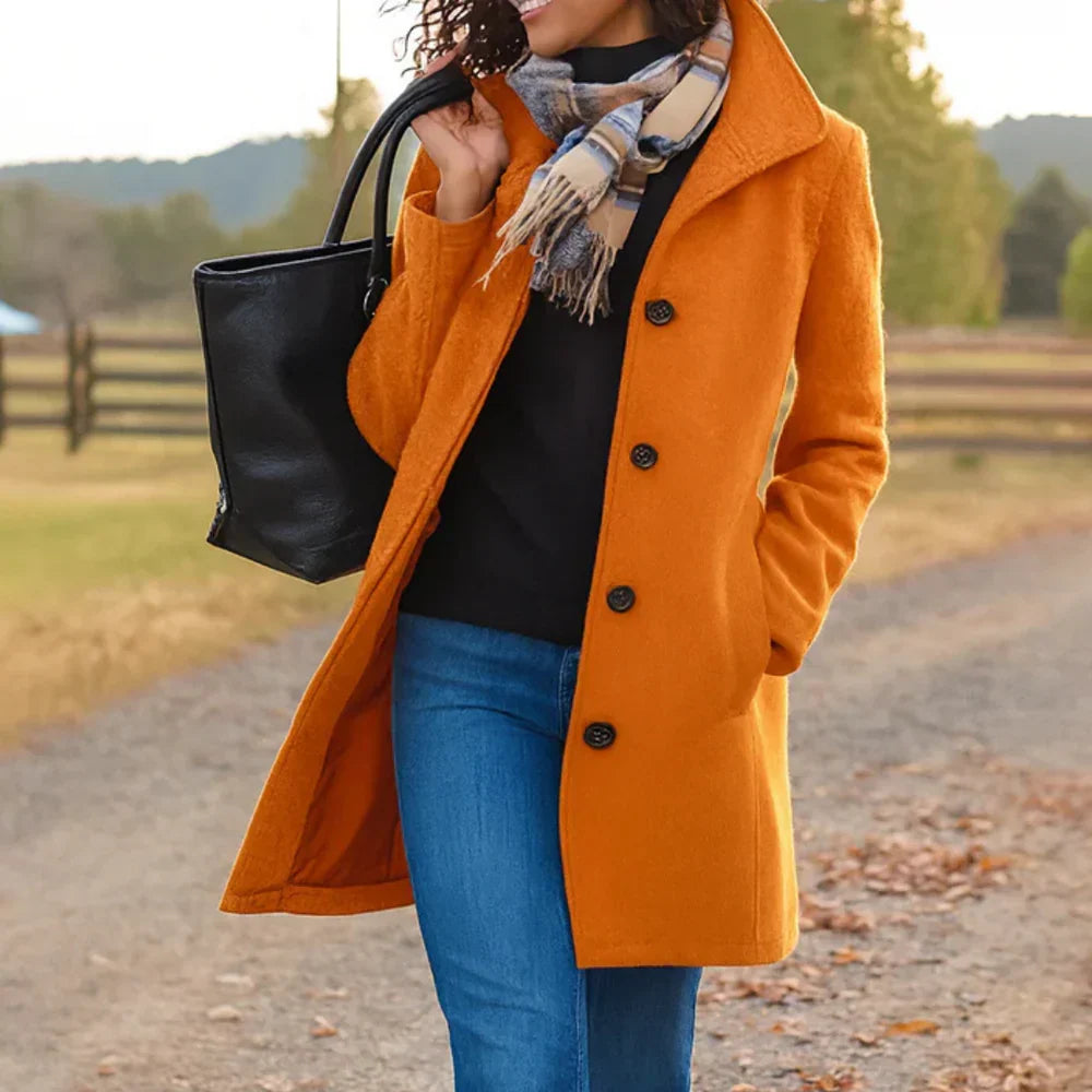 Women's long button-front coat with shirt collar, long sleeves and side pockets