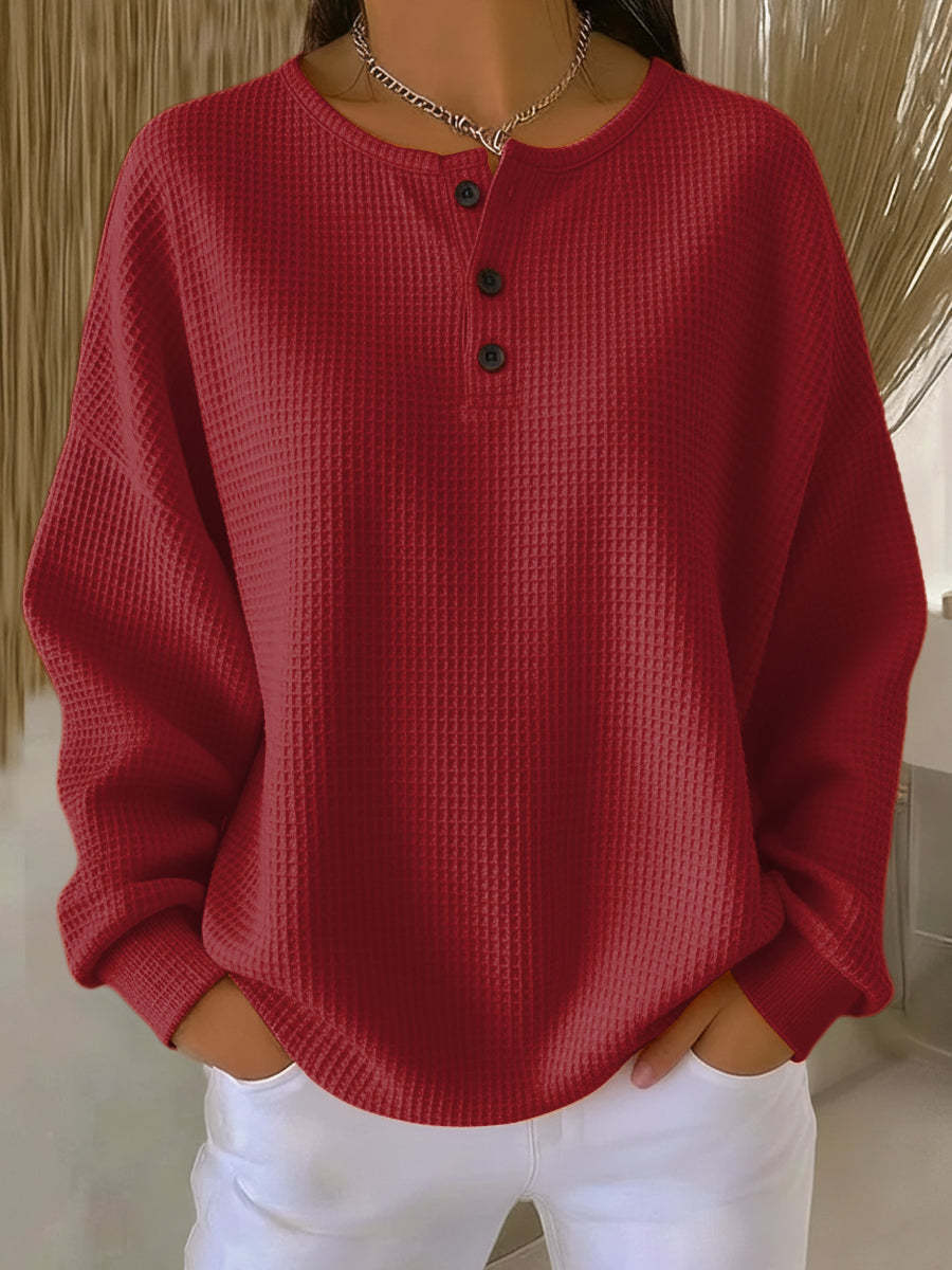 Women's textured waffle Henley top with round neck, long sleeves and button placket