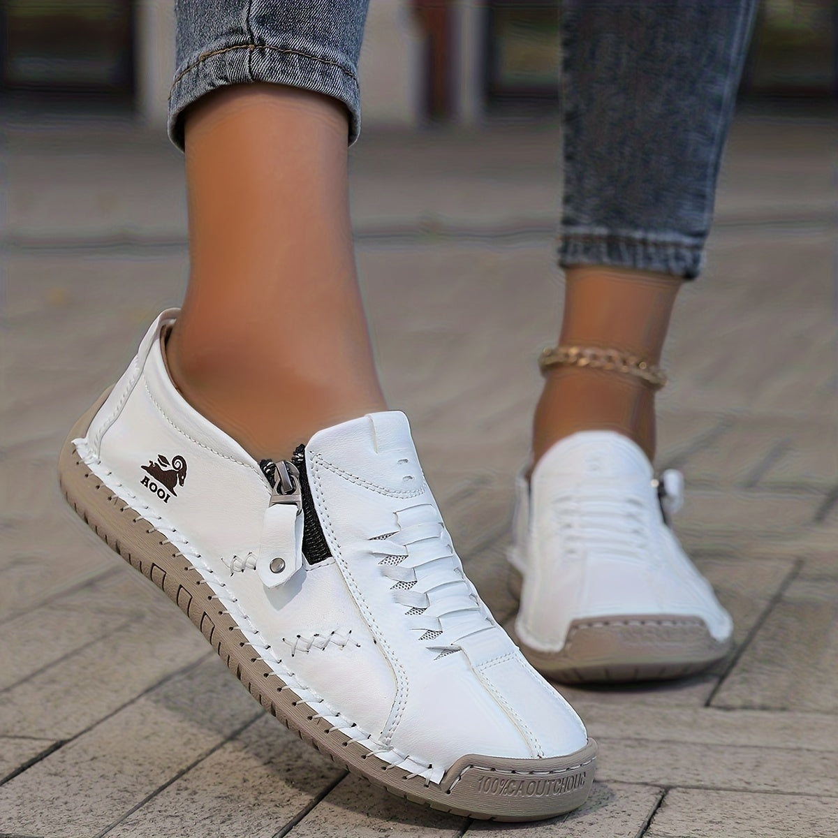 Low-profile lace-up trainers with side zip and flat sole