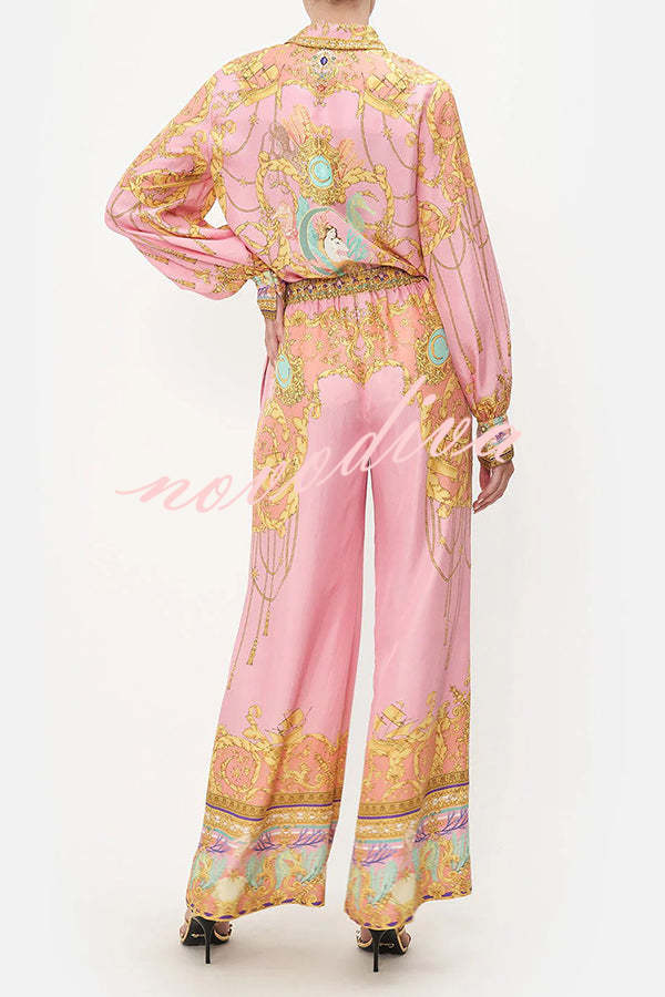 Woman wearing a pink abstract print shirt and wide-leg trousers set