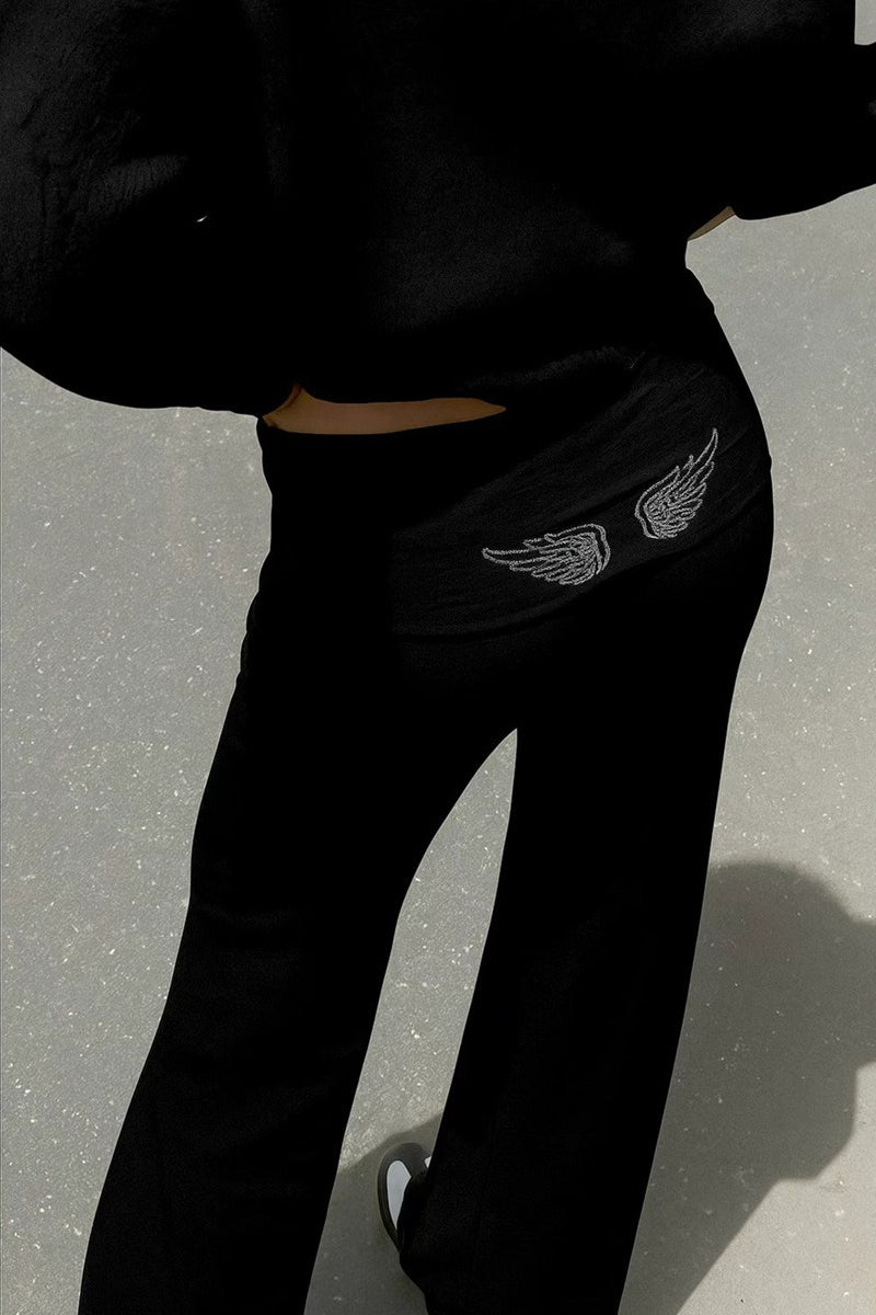 Women's hooded sweatshirt with large sequin wing graphic on the back