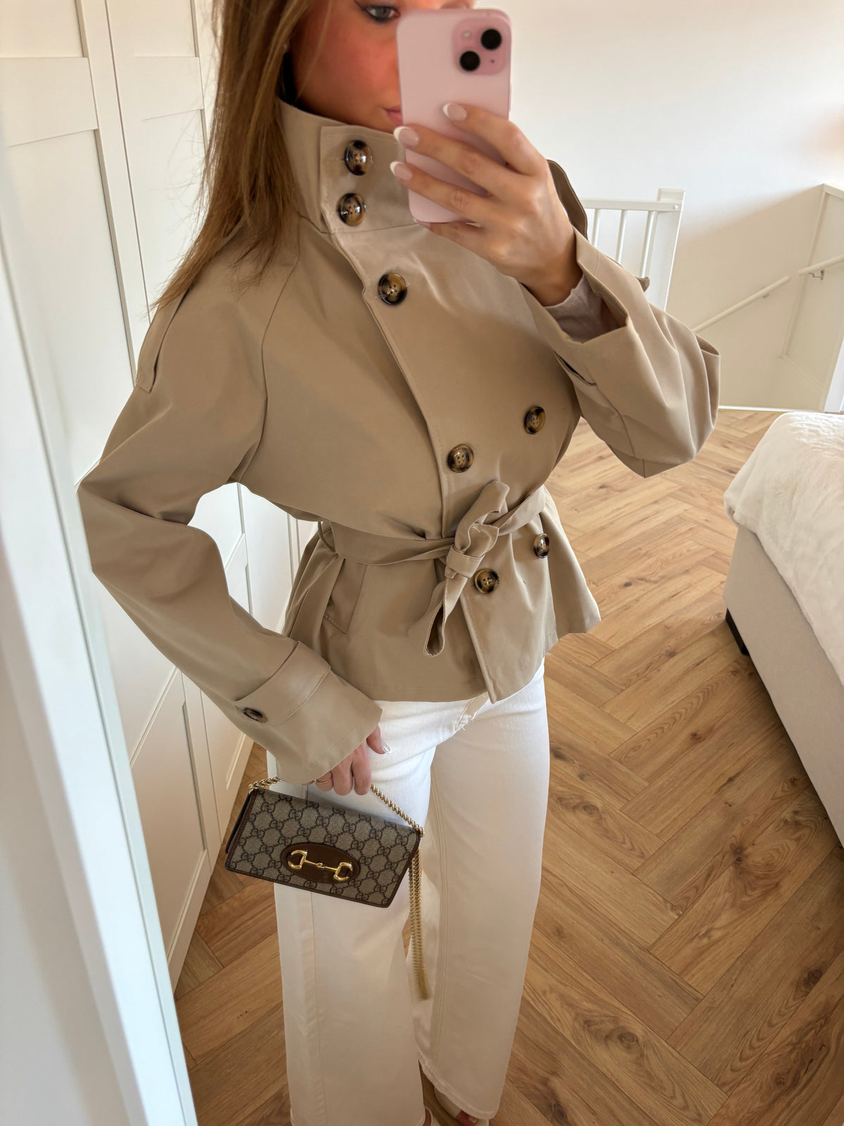 Women's beige belted trench jacket with high collar and long sleeves