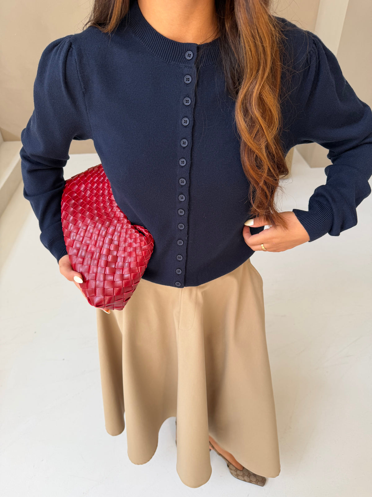 Women's navy button front cardigan with crew neckline and long sleeves