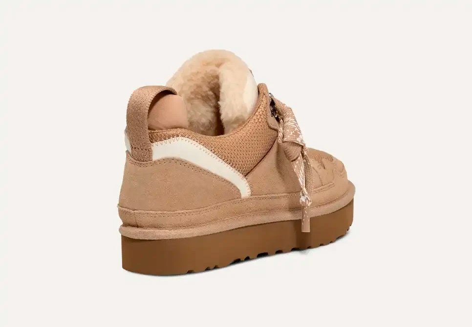 Beige women's high-top trainers with patterned laces and plush ankle trim