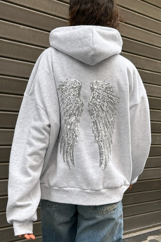 Women's hooded sweatshirt with large sequin wing graphic on the back