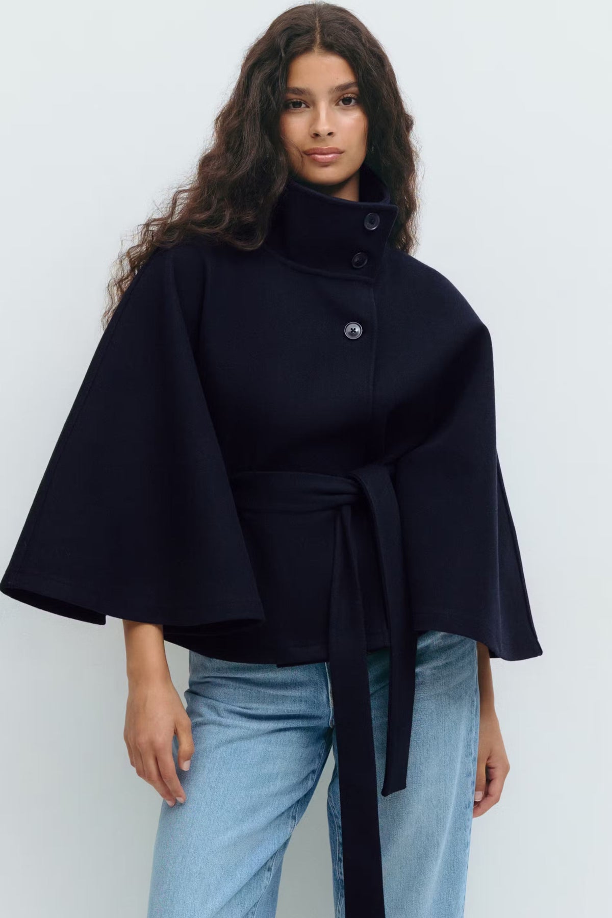 Women's short belted jacket with high collar, button front and wide sleeves