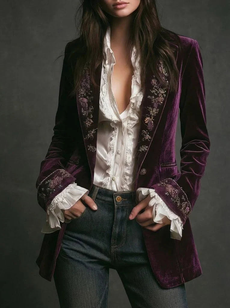 Women's long embroidered velvet jacket with structured shoulders and decorative floral cuffs