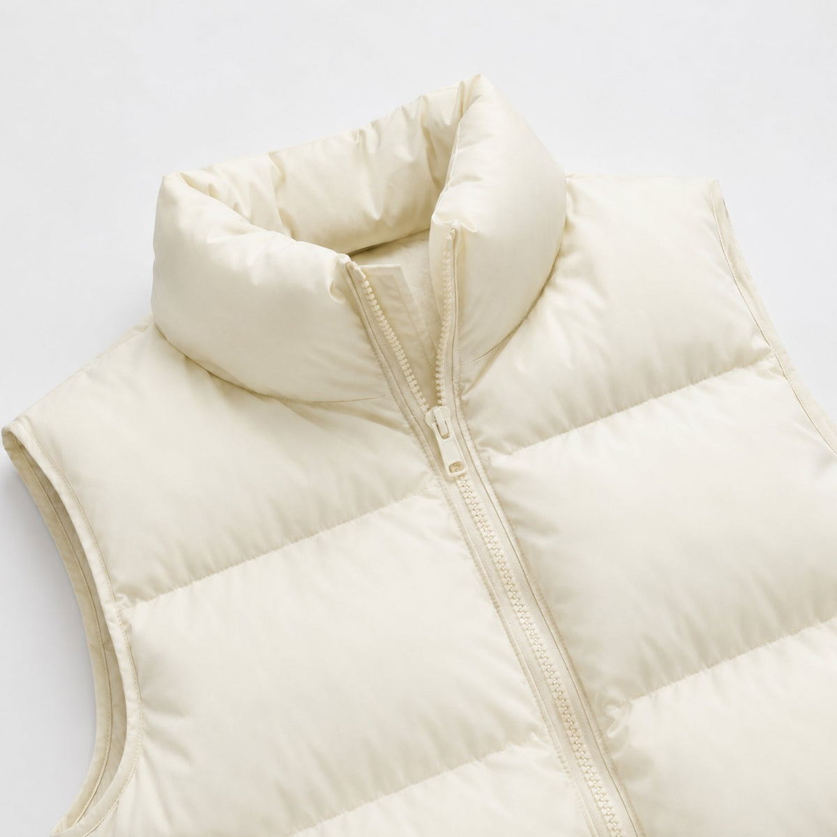 Women's cropped quilted puffer vest with high collar and zip front