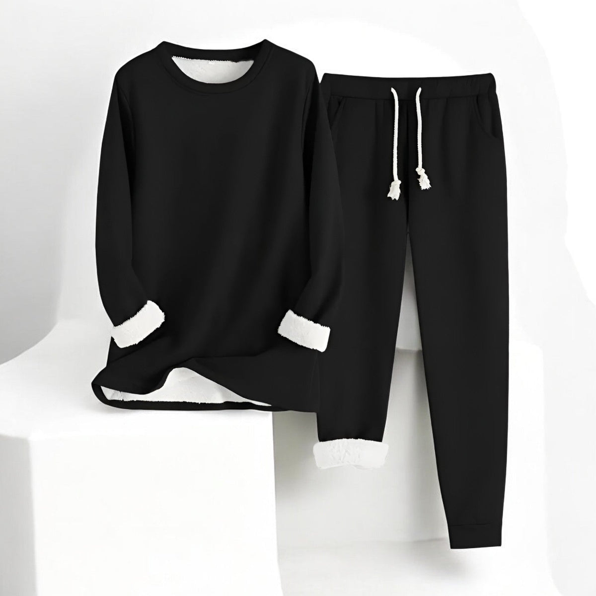 Two-piece crew neck sweatshirt and jogger set with contrasting white cuffs and drawstring trousers