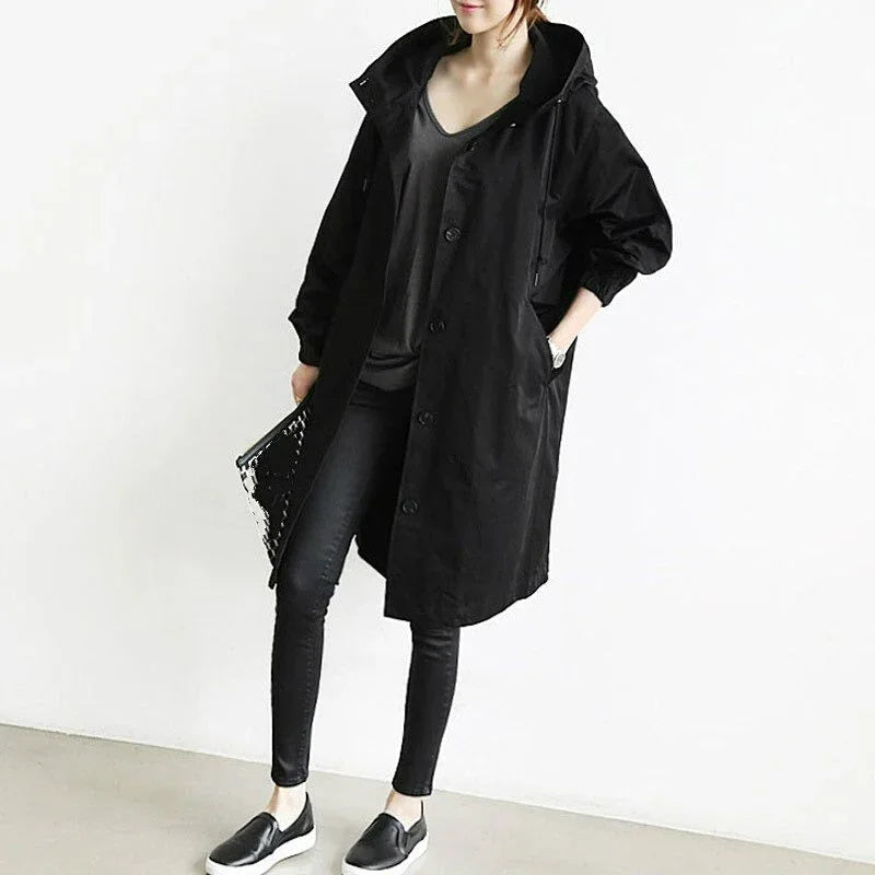 Women's long hooded trench coat with button front and side pockets