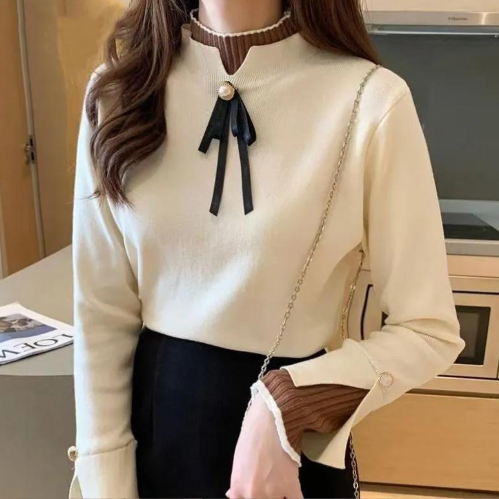 Women's fitted jumper with high ribbed neck, long sleeves and bow detail