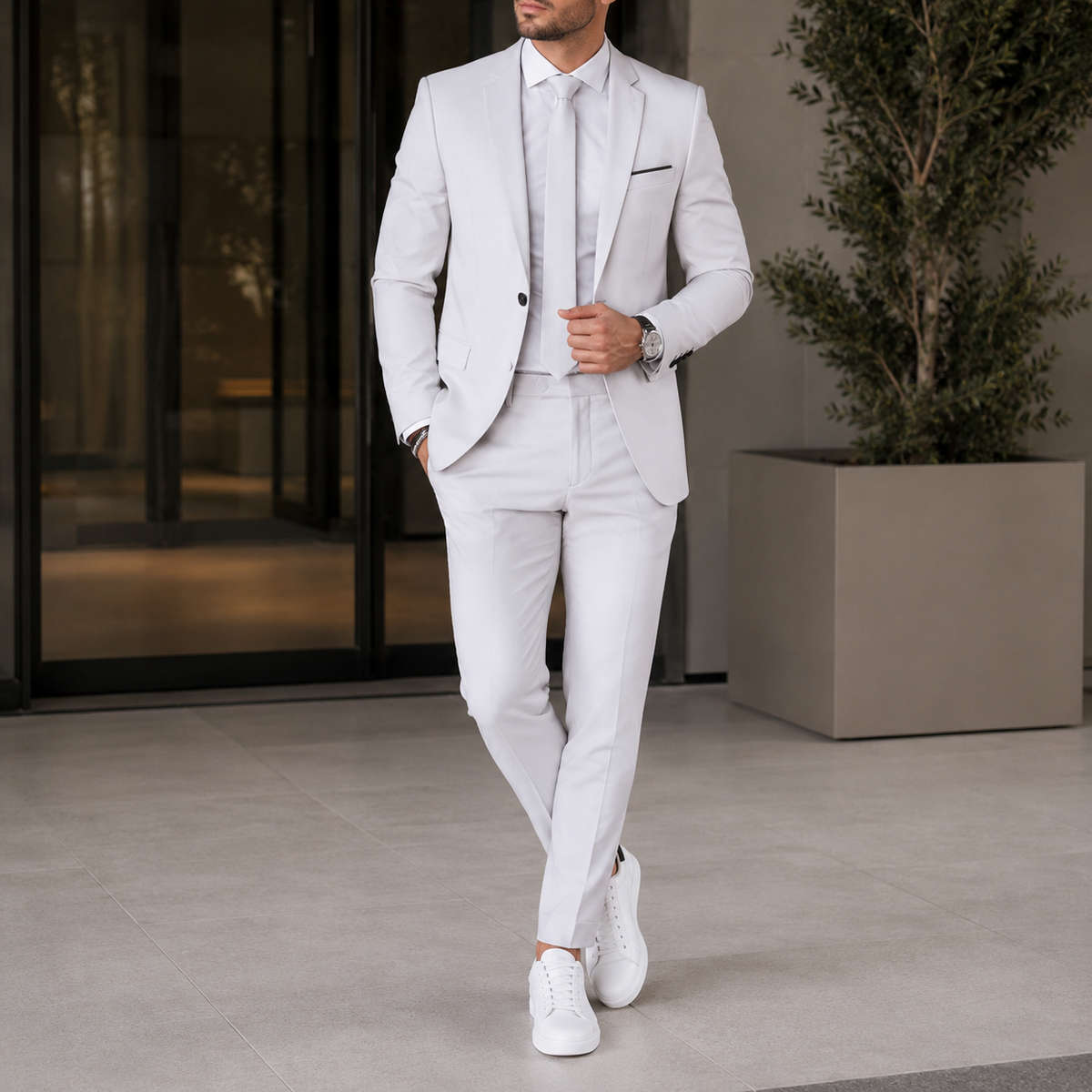 Men's two piece suit with notched lapels, matching trousers and button fastening