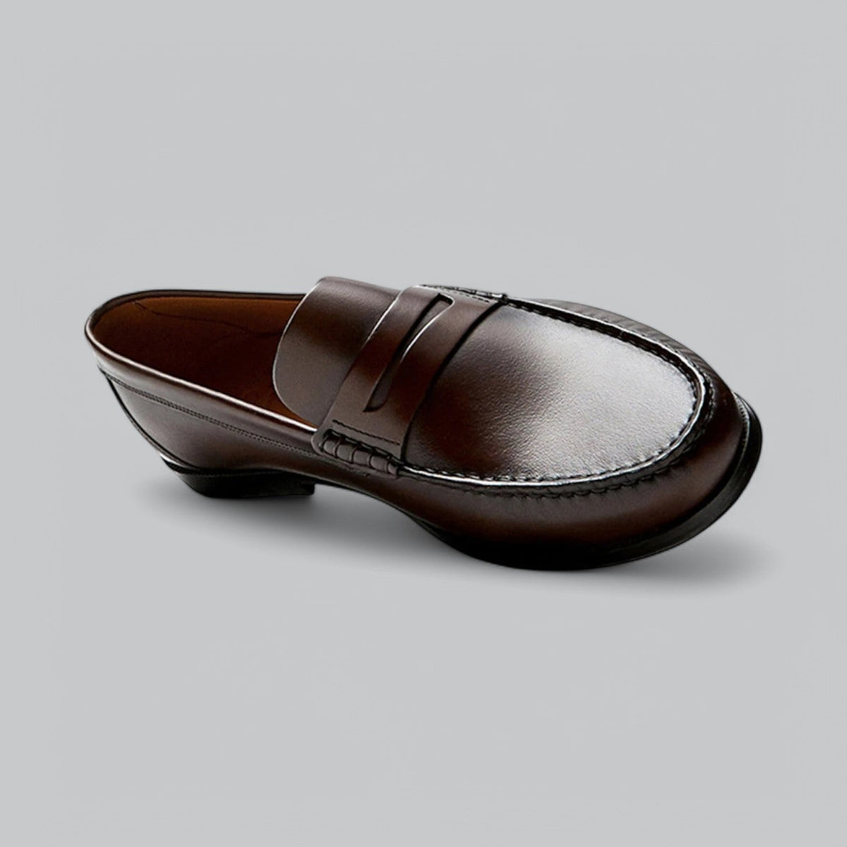Men's plain penny loafers with stitched trim and low heel