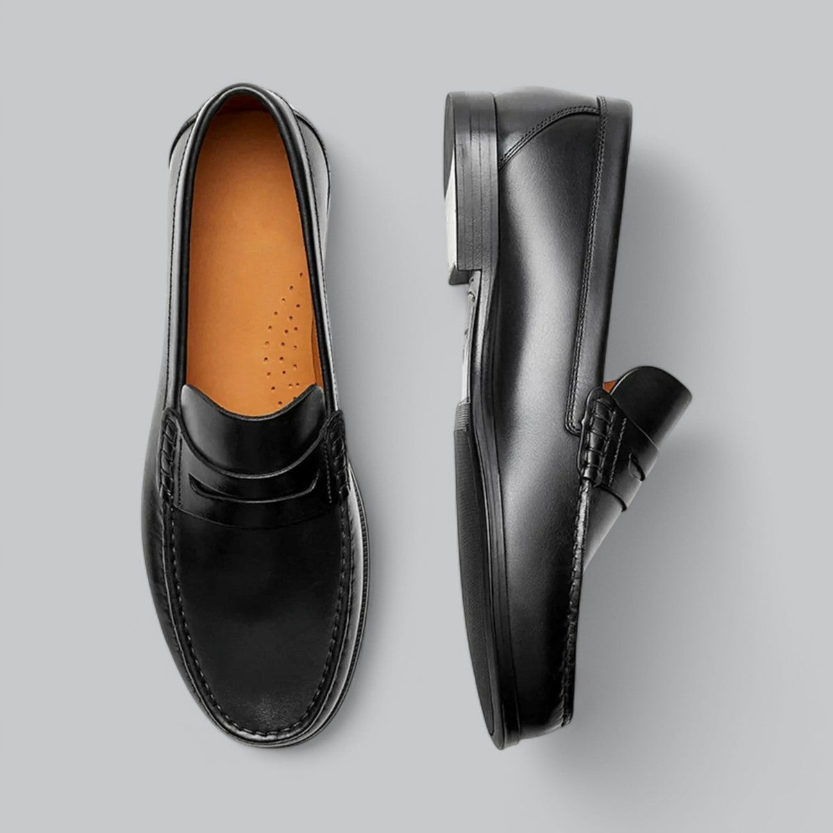 Men's plain penny loafers with stitched trim and low heel