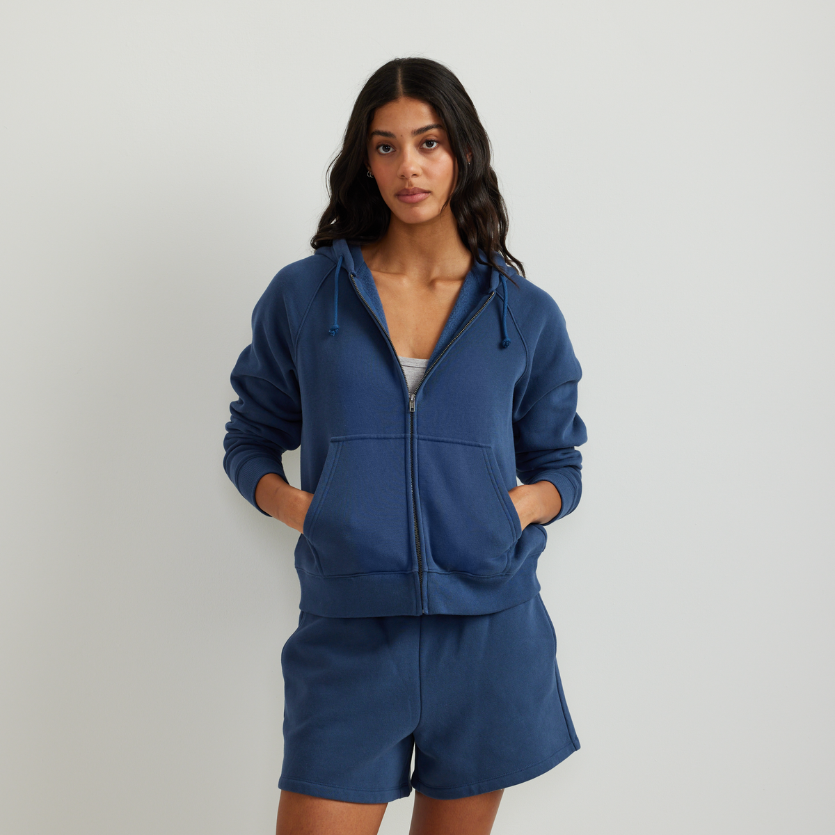 Women's full-zip hooded sweatshirt with long sleeves and front pouch pockets