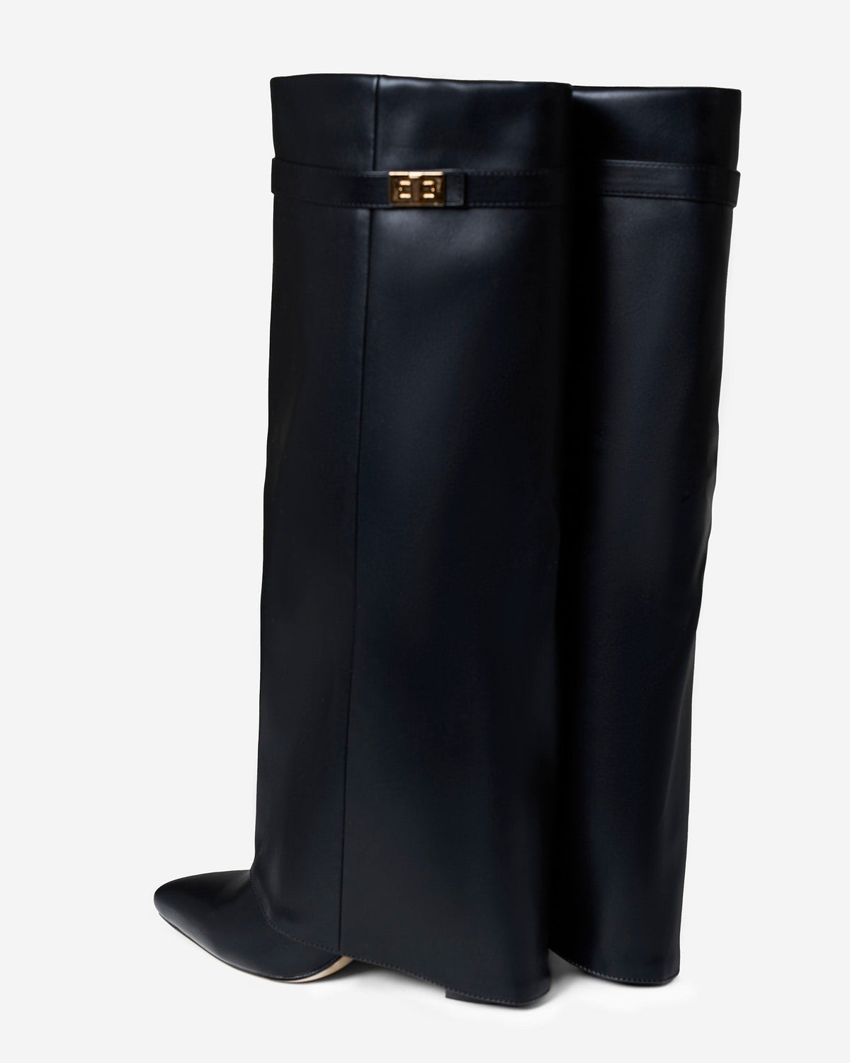 Black knee-high boots with pointed toes, low heels and buckle strap detail