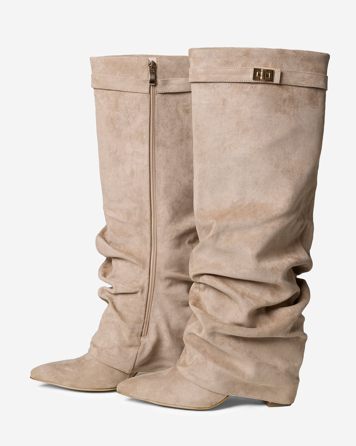 Women's beige slouchy knee-high boots with pointed toes, low heels and buckle strap detail